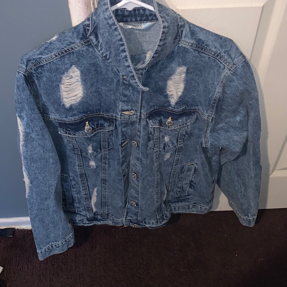 Jean jacket with rips